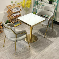 Ensemble table et chaises de luxe en acier inoxydable couleur marbre pour réception commerciale, négociation, restaurant, hôtel, café