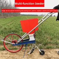 Nouveau semoir de maïs à arachide poussé à la main intégré soja sésame oléagineux planteur d'engrais Machine pour une plantation efficace