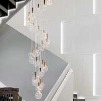 Lumières d'escalier, lustres duplex, modèles de salles de restaurant simples, villas d'hôtel, lumière postmoderne rotative de luxe en cristal