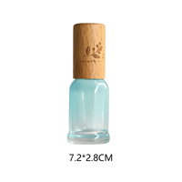 Bouteille d'emballage en verre aromatique bleu dégradé avec bouchon en bois de hêtre