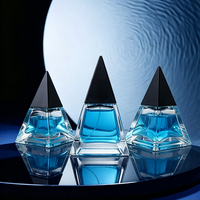 Einzigartige FEA13 Crimp 30ml 50ml 100ml Pyramidenförmige leere Parfümflasche Glas-Sprühflaschen Individuelle Verpackungen