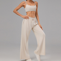 Ensemble de yoga 2 pièces pour femme avec logo personnalisé, finition à pois, soutien-gorge à double bretelle et pantalon large pour l'entraînement et la gym
