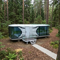 Maison capsule spatiale de luxe de 20 pieds, maison modulaire préfabriquée portable, cabine d'hôtel intelligente avec design en verre panoramique