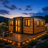 Maison conteneur extensible préfabriquée en planches de bois avec cadre noir, pour camping forestier, cabane de glamping, villa avec terrasse et patio, fournisseur d'usine en gros