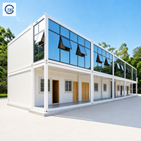 Maison préfabriquée en conteneur à deux étages avec mur en verre modulaire, fenêtre à auvent, bureau temporaire, dortoir pour le personnel, structure en acier