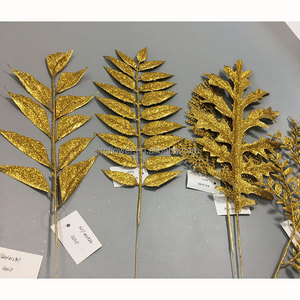 Venta al por mayor de plantas y flores artificiales de Monstera hojas de <span class=keywords><strong>palma</strong></span> de hoja <span class=keywords><strong>dorada</strong></span> boda decoración del hogar rama de hoja artificial - Product Image 1