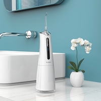Nicefeel Tragbarer Wasserflosser 300ml Tank Schwarz Kabelloses Zahnpflegegerät für Zuhause und Hotel Batteriebetriebenes Elektrisches Plas