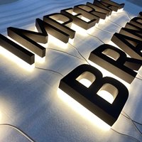 Enseignes lumineuses personnalisées en acier inoxydable, lettres éclairées à halo doré avec lettres en relief polies miroir