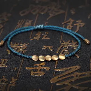 Commercio all'ingrosso filo di cotone intrecciato a mano irregolare perline di rame tibetano corda stringa braccialetti per la salute Multi colore gioielli da uomo fai da te