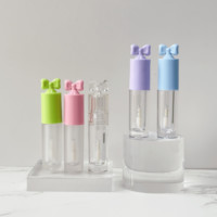 Tube de brillant à lèvres en plastique rose de 2,5 ml, vente en gros, avec grande brosse, tête papillon, bouchon à vis, emballage cosmétique, impression personnalisée