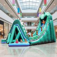 Toboggan gonflable dinosaure en PVC de qualité commerciale avec motif palmier, idéal pour la location de fêtes d'enfants