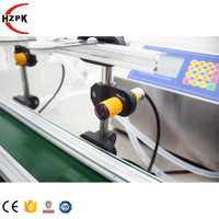 Remplisseuse de liquide automatique à 4 têtes HZPK avec bande transporteuse pour le remplissage de bouteilles de cosmétiques et de boissons
