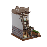 Café de campagne, coin lecture, un puzzle en bois 3D et un kit de maison de poupée miniature avec des sièges extérieurs et des jardinières