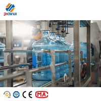 Machine de remplissage d'eau en bouteilles plastiques de 5 gallons, petite capacité, 100 BPH, pour entreprise de production d'eau de source à domicile