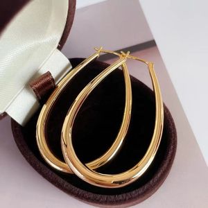 Xinfly Latest Fashion Hypoallergenic AU750 18K Pure Gold Teardrop Oval Chunky <b>Large</b> Lady Big <b>Hoop</b> Earrings for Woman - Product Image 1