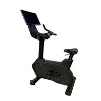 Un vélo d'appartement magnétique professionnel puissant avec écran miroir, fabriqué dans une usine chinoise