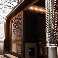 Cabine de bien-être extérieure noire, design épuré, combinant sauna et bain de glace, chauffée au bois, double fonction, pod de loisirs, taille personnalisée, livraison rapide