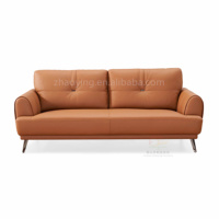 Sofa de chambre d'hôtel de taille normale de haute qualité Prix d'usine à vendre Demi-housse en cuir souple avec pieds en métal en mousse à haute densité