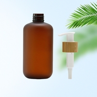 Nouveau modèle de bouteille en plastique PET ambré givré avec logo personnalisé et pompe à lotion en bambou pour l'emballage de lotion corporelle