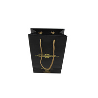 Vente en gros de sacs d'emballage en papier noirs avec logo imprimé personnalisé pour chaussures et vêtements sac d'emballage en papier pour cadeau et bijoux pour achats