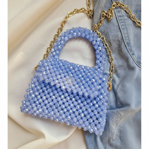 Elegant iridescent light <b>blue</b> crystal beaded mini bag with structured flap and luxurious gold chain strap, at wholesale prices. - Product Image 1
