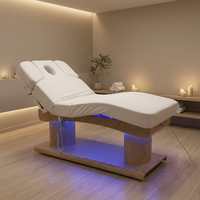 Lit de massage électrique réglable à 4 moteurs, populaire pour les salons de beauté, les écoles, les hôtels, les gymnases, les sous-sols et les traitements de ventouses