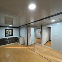 Casa Contenedor Expandible de Acero con Muro Cortina de Vidrio, Plegable, Antinieve, Diseño Moderno, para Uso en Oficinas Exteriores, Centros Comerciales