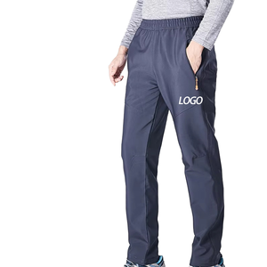 Pantalon de jogging décontracté pour homme en polyester bleu foncé à taille élastique, séchage rapide, avec poches et logo sur la jambe droite, idéal pour l'automne - Product Image 1