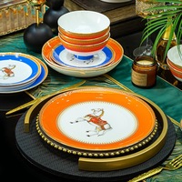 Assiette orange de luxe européenne à bord doré en céramique, ensemble de vaisselle à cheval, 60 pièces