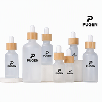 Vente en gros de flacons d'huile capillaire cosmétique essentielle de 5 ml à 100 ml, flacon compte-gouttes en verre givré de 30 ml avec bouchon en bambou