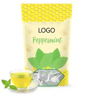 Mint tea bags mixed with honey, crystal, healthy digestion, nutrition, natural organic herbs, and caffeine free tea bags