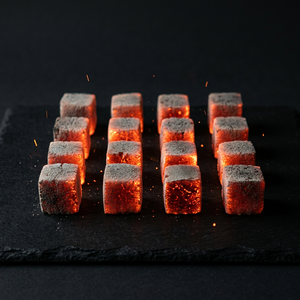 Our Indonesian-produced coconut shell charcoal <b>cube</b> briquettes <b>light</b> up quickly. - Product Image 1