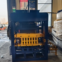 Machine automatique de fabrication de briques en ciment QT4-15B pour la production de blocs creux et de pavés