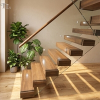 Escalier flottant moderne Tanlong en noyer foncé avec garde-corps en verre sans cadre, main courante en bois massif, escalier cantilever à montantes ouvertes