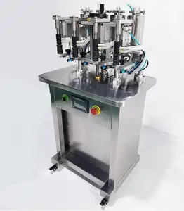 Machine de remplissage de liquide de petite bouteille de pulvérisation d'eau de parfum cosmétique d'huile essentielle de table à quatre têtes