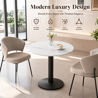 Table de bistrot ronde en pierre frittée avec base métallique stable, design minimaliste pour cafés, hôtels et restaurants