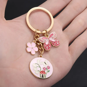 1 llavero de flor de mariposa esmaltada bonita, llavero de jardín de aleación, para llaves de coche, mochilas, carteras - Product Image 1