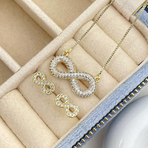Ensemble de bijoux pour femmes plaqué or 18 carats, boucles d'oreilles et collier avec symbole de l'infini - Product Image 1