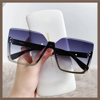 Lunettes de soleil 2026 pour femmes, style œil de chat, design tendance, nouvelles lunettes sans monture, vente en gros à bas prix pour femmes