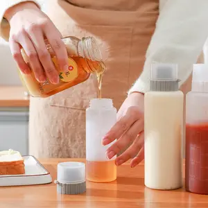 2023 סיטונאי מטבח פלסטיק רוטב דבש לסחוט אבק הוכחה תיבול בקנה מידה בקבוק