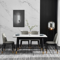 Ensemble de table à manger moderne minimaliste tendance, surface en pierre frittée, design pliable pour appartement compact, salon