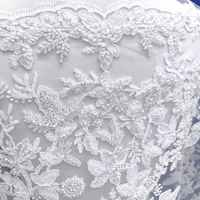 Tissu en dentelle brodée de sequins et de strass de luxe avec motif floral pour robes de mariée et décorations