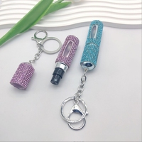 Le distributeur de parfum transfrontalier de 5ml peut être ajouté plusieurs fois clé de vaporisateur portable cloutée de diamants