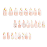 Vente en gros de faux ongles en acrylique de style français |   Charmes personnalisables en dentelle rose nude avec nœud 3D et strass, forme amande, longueur longue