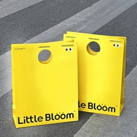 Emballage de vêtement avec logo personnalisé le plus vendu avec poignée trouée sac d'expédition personnalisé réutilisable et écologique