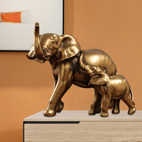 Figurine d'éléphant en résine dorée de style antique moderne, avec un tronc surélevé, statue d'animal pour la décoration de table intérieure