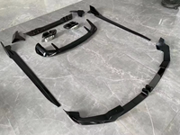 Kit carrosserie style MP noir pour BMW X5 G05 2023+ LCI, comprenant lèvre avant, lèvre arrière, jupes latérales et spoiler de toit, aspect carbone