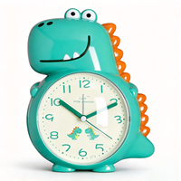 Dinosaurier-förmiger Tisch-Wecker, mit Wechselbarer Melodie & Simulierter Klingel, Schlummerfunktion & Nachtlicht, Niedlich und Vielseitig für Kinder