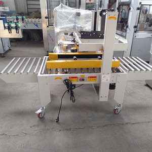 Machine de scellage automatique de boîtes, scelleuse de cartons à charge lourde pour les petites boîtes de produits chimiques industriels - Product Image 1