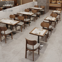 Ensemble de mobilier commercial en cuir pour hôtel, café, restaurant : banquette demi-courbe, table et chaises en marbre